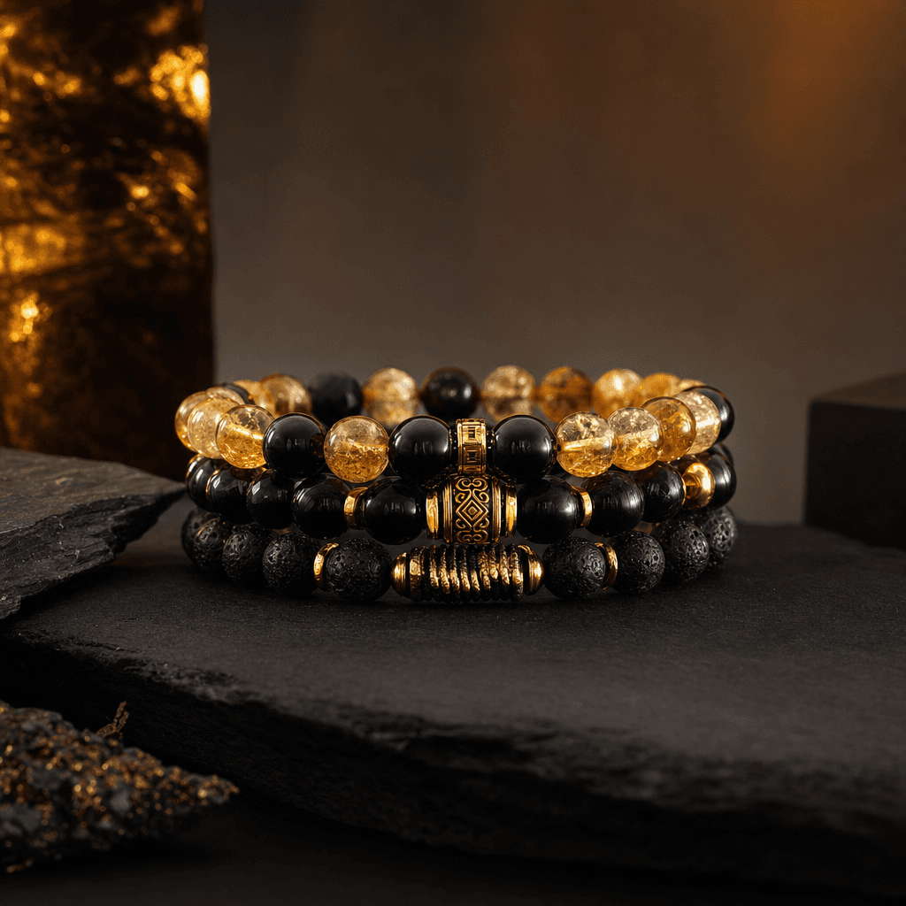 Wealth stack bracelet with citrine and black tourmaline stones on a ceramic surface